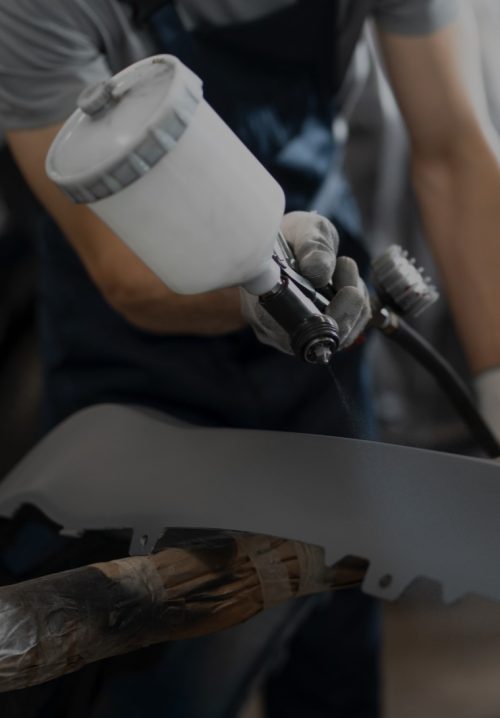 male-painter-overalls-doing-his-work-car-shop